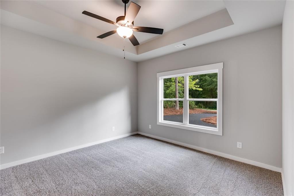 466 Mt Zion Church Road Tallapoosa, GA 30176 - Photo 26 of 42 an empty room with a window and a fan