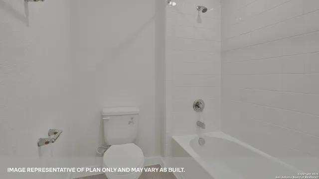 a bath tub sitting next to a white toilet and vanity
