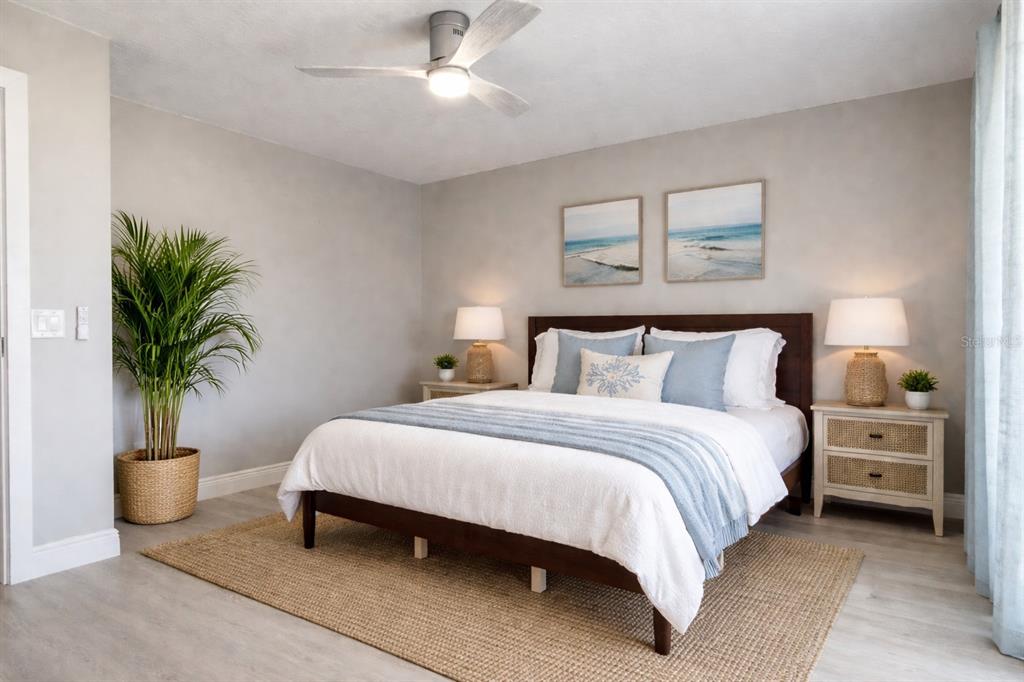 1244 Beachside Lane Indialantic, FL 32903 - Photo 14 of 25 a bedroom with bed and a potted plant