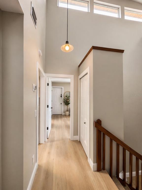 1244 Beachside Lane Indialantic, FL 32903 - Photo 17 of 25 a view of a hallway with wooden floor and closet area