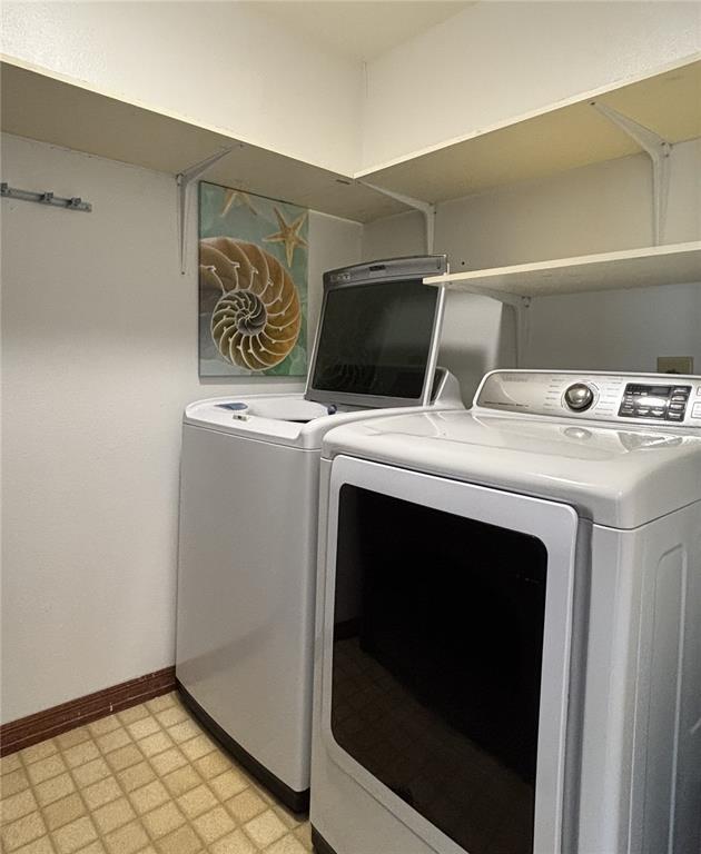 1244 Beachside Lane Indialantic, FL 32903 - Photo 20 of 25 a utility room with dryer and washer