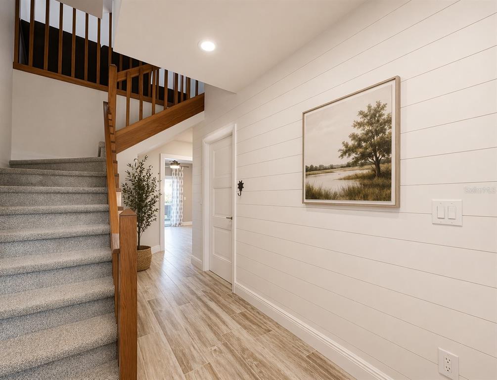 1244 Beachside Lane Indialantic, FL 32903 - Photo 2 of 25 a view of a hallway with wooden floor and entryway