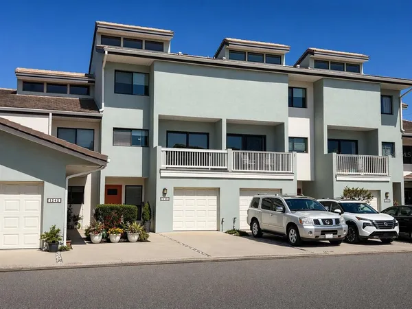 a view of a car park in front of house