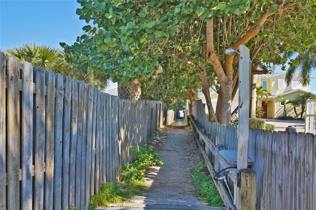 1244 Beachside Lane Indialantic, FL 32903 - Photo 23 of 25 a view of a pathway of a wooden fence