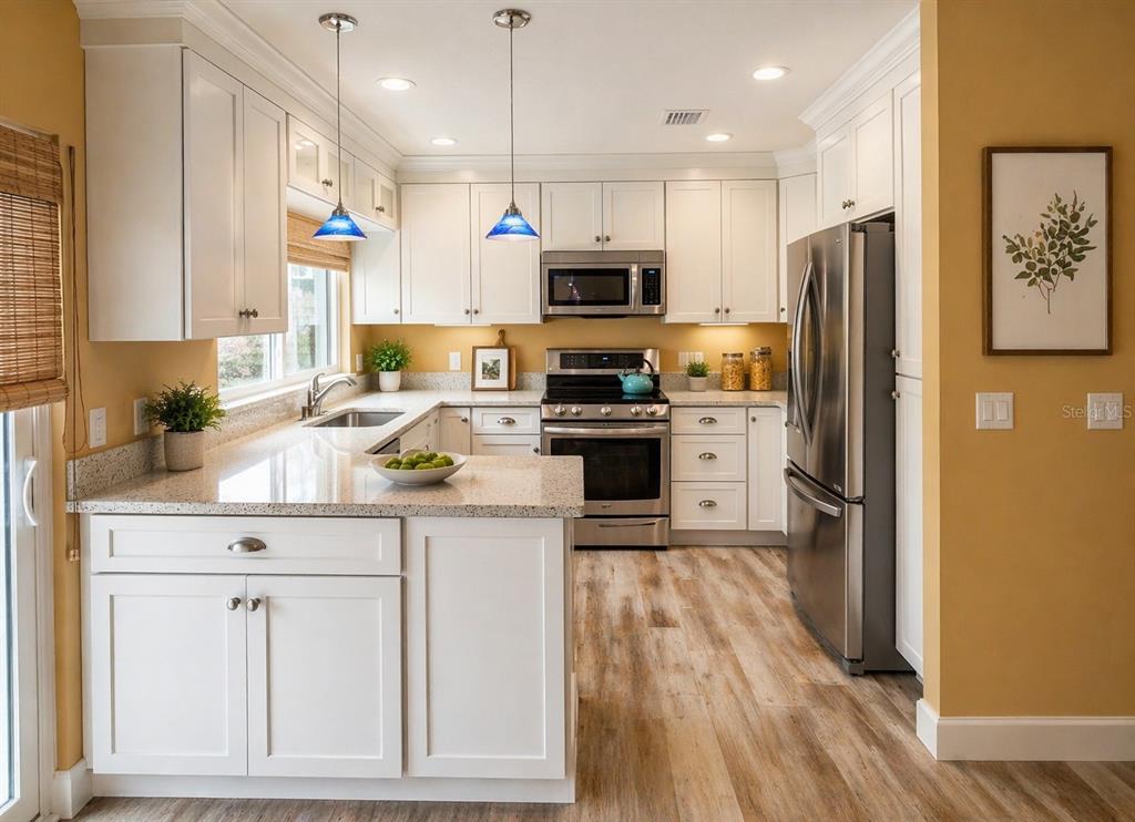 1244 Beachside Lane Indialantic, FL 32903 - Photo 3 of 25 a kitchen with granite countertop a refrigerator stove and sink
