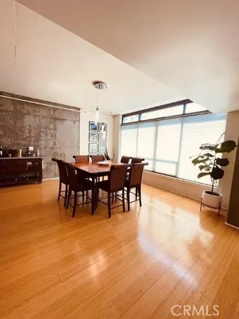 a view of a dining room with furniture and a table and chairs