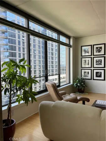 a living room with furniture and flowers