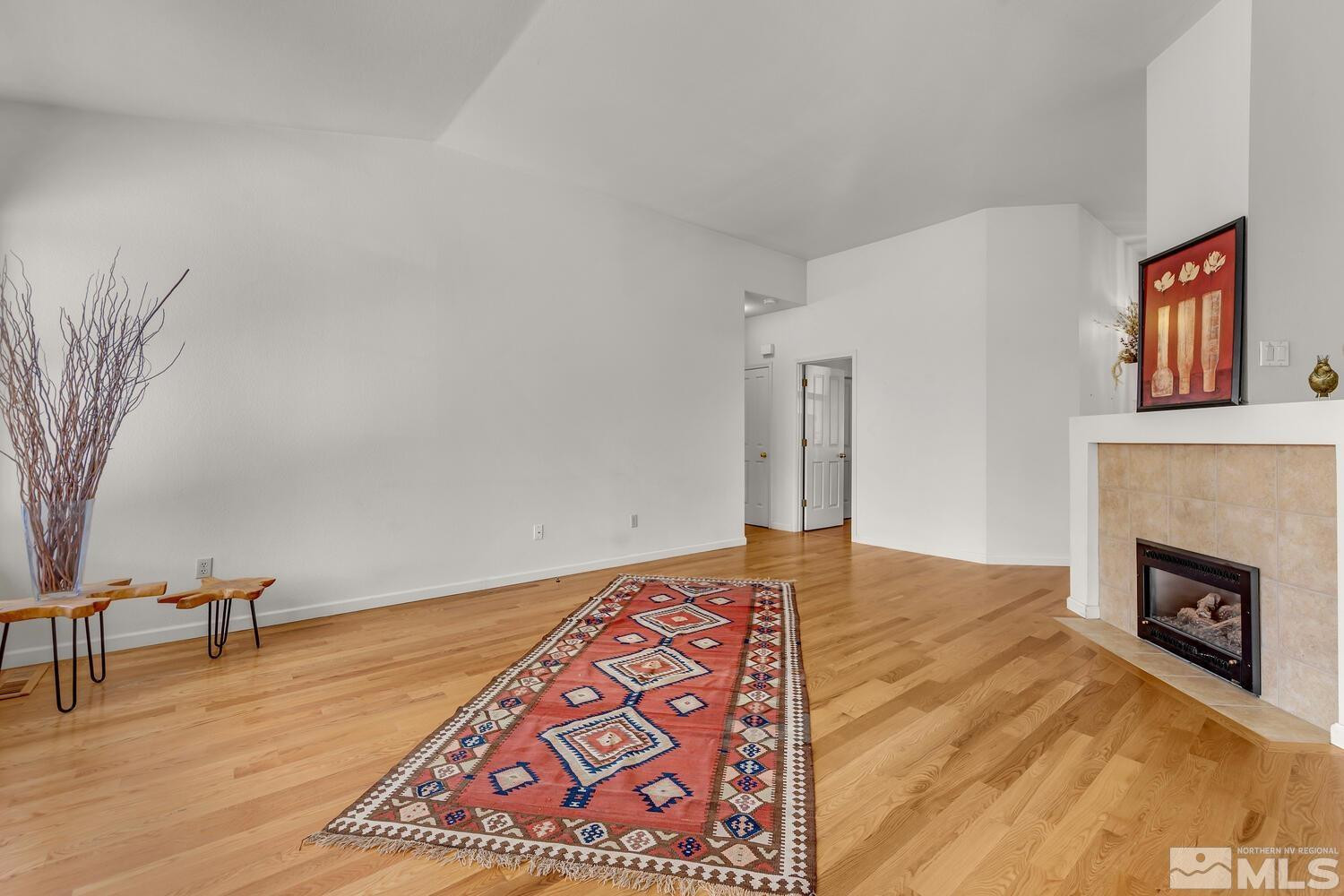 195 Riverbrook Court Reno, NV 89519 - Photo 9 of 40 a view of an empty room and fire place