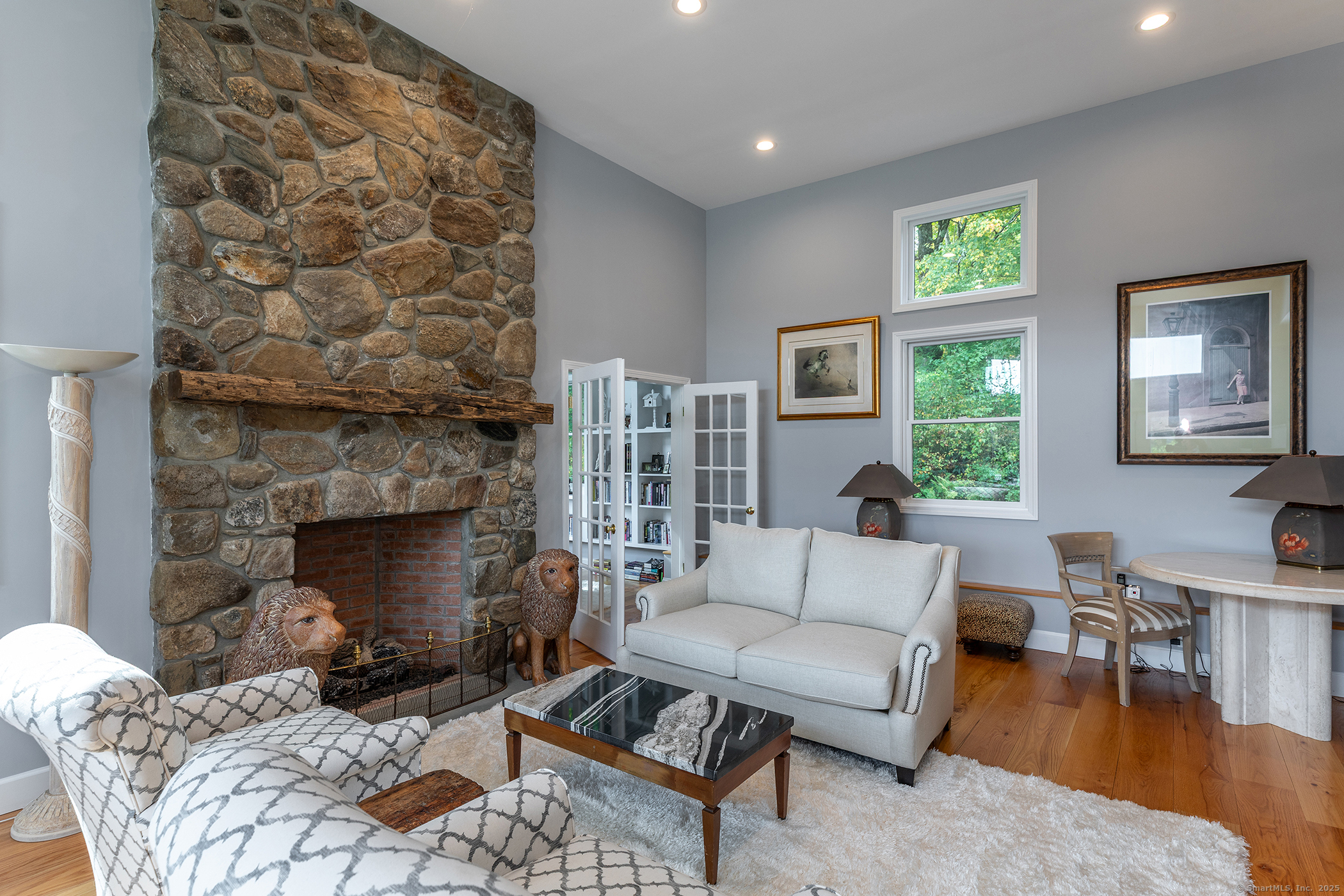 168 Cobble Road Kent, CT 06757 - Photo 20 of 40 a living room with furniture and a fireplace