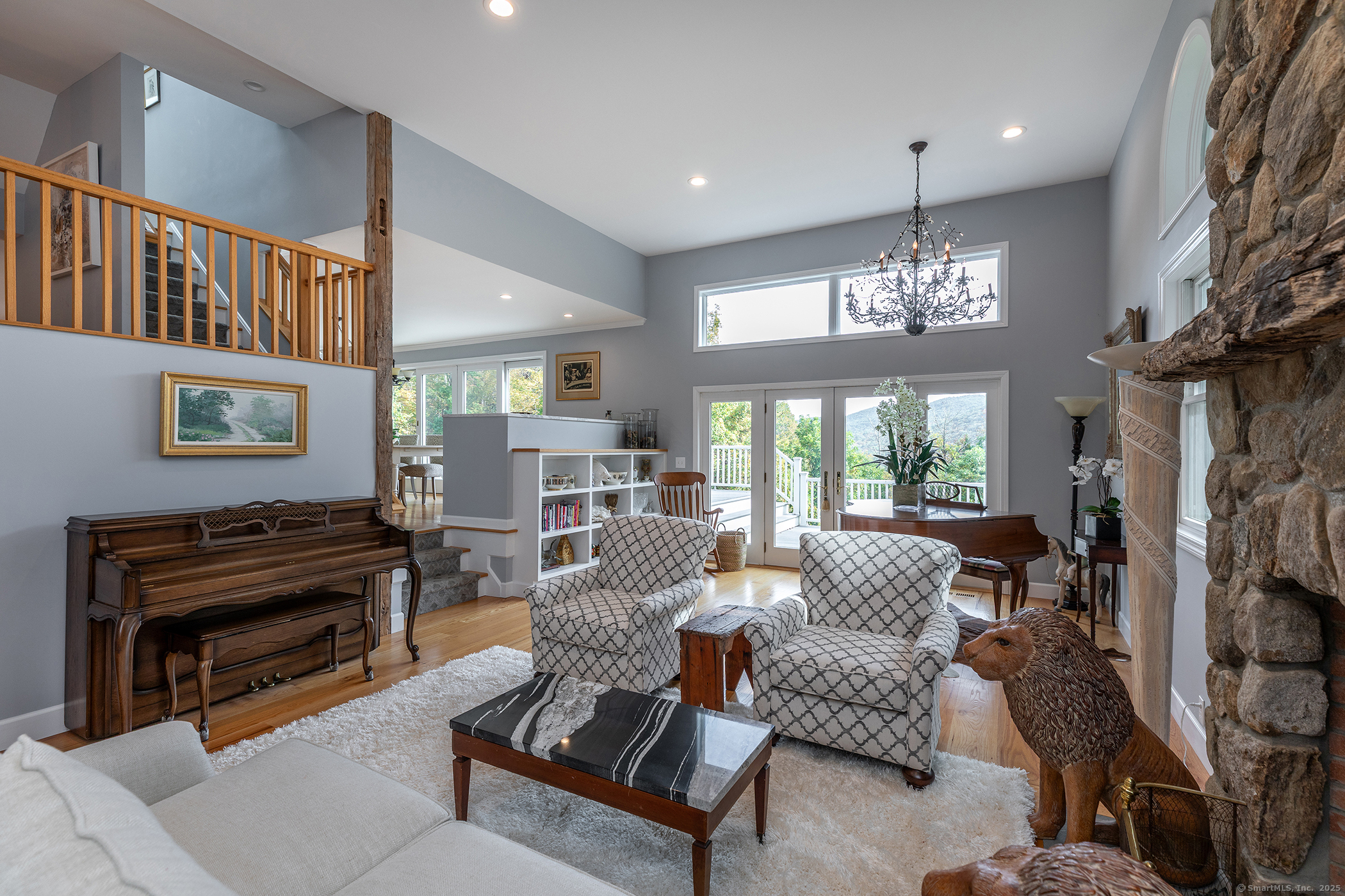 168 Cobble Road Kent, CT 06757 - Photo 21 of 40 a living room with furniture and a chandelier