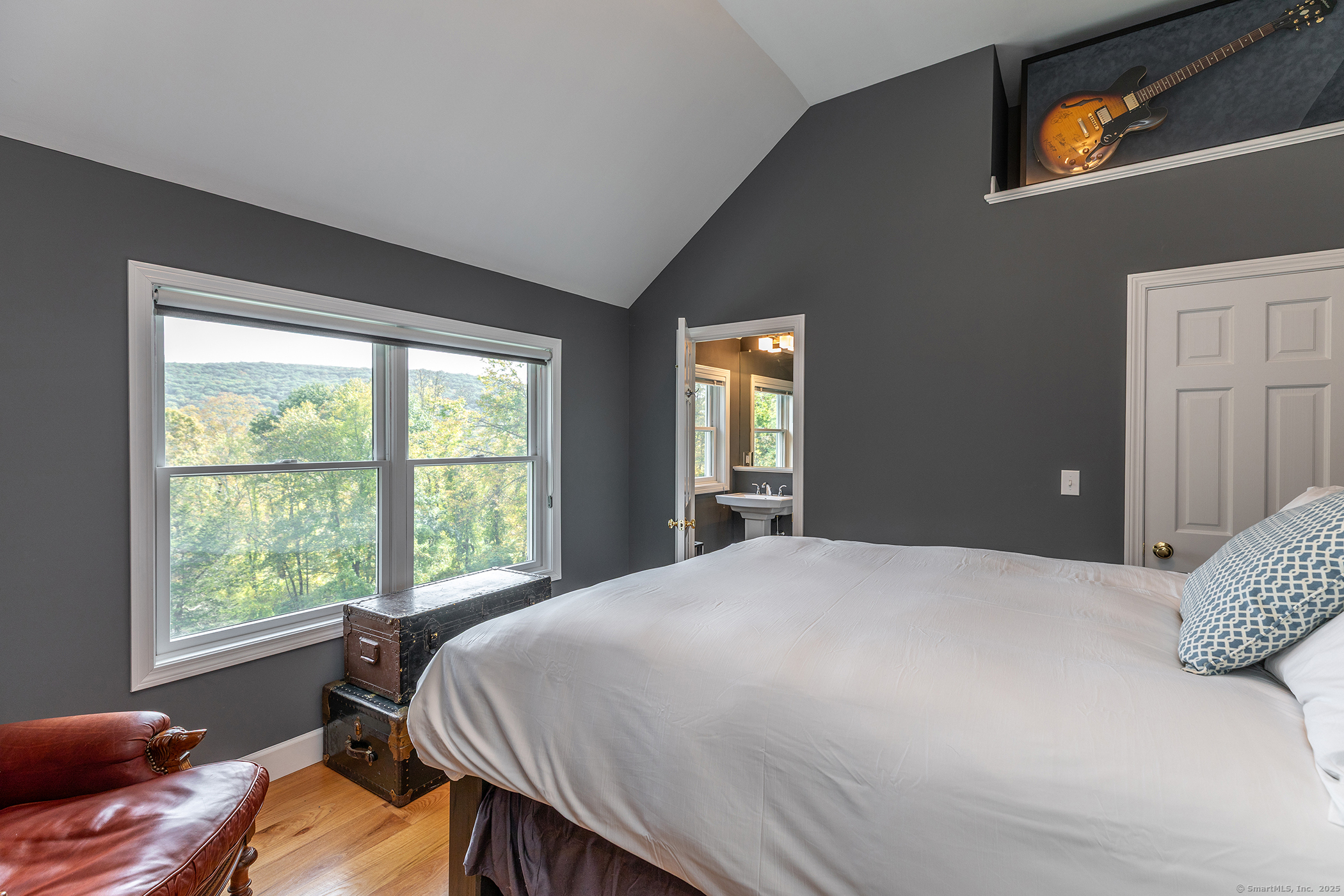 168 Cobble Road Kent, CT 06757 - Photo 30 of 40 a bed sitting in a bedroom next to a window