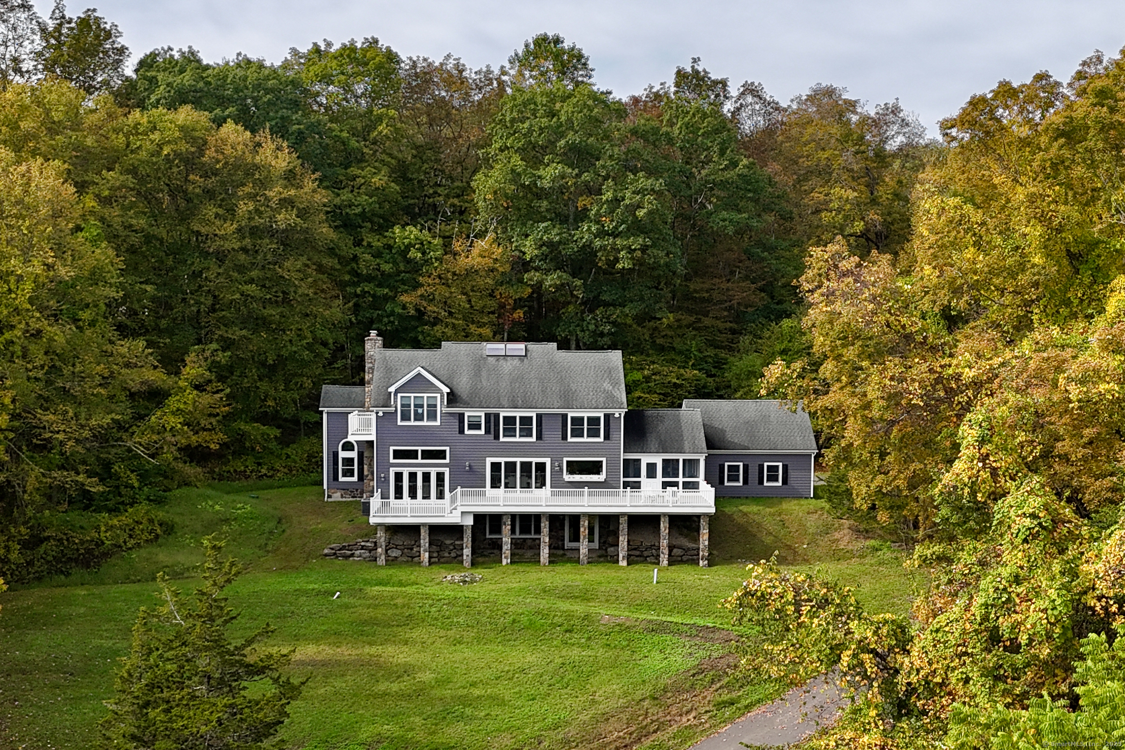 168 Cobble Road Kent, CT 06757 - Photo 38 of 40 a view of a house with a big yard and large trees