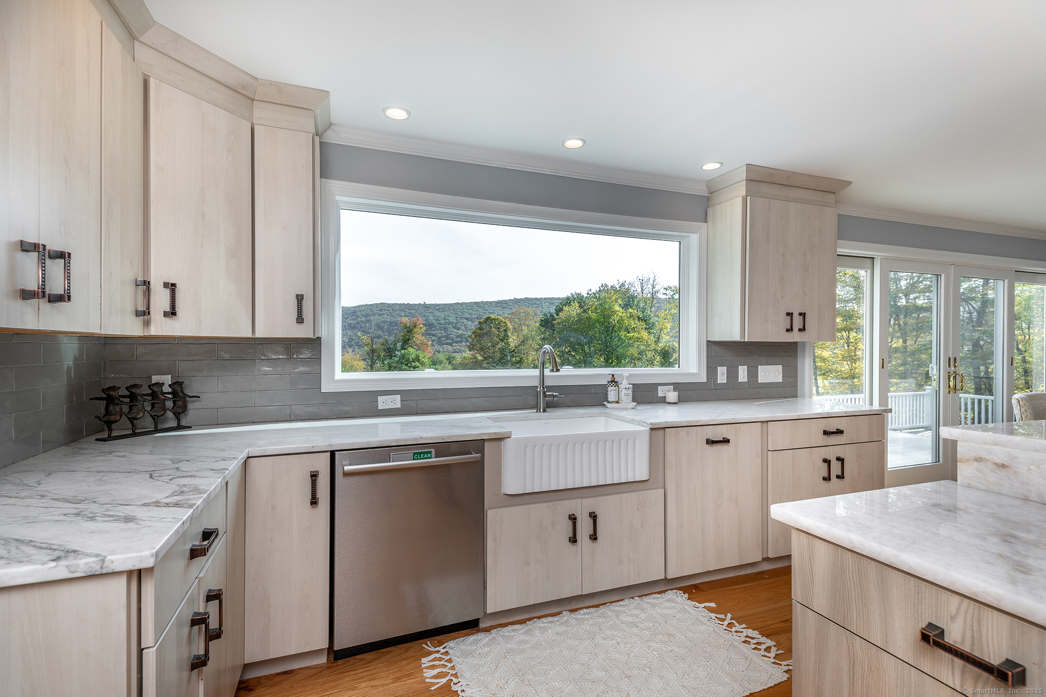 168 Cobble Road Kent, CT 06757 - Photo 4 of 40 a kitchen with a sink stove and cabinets