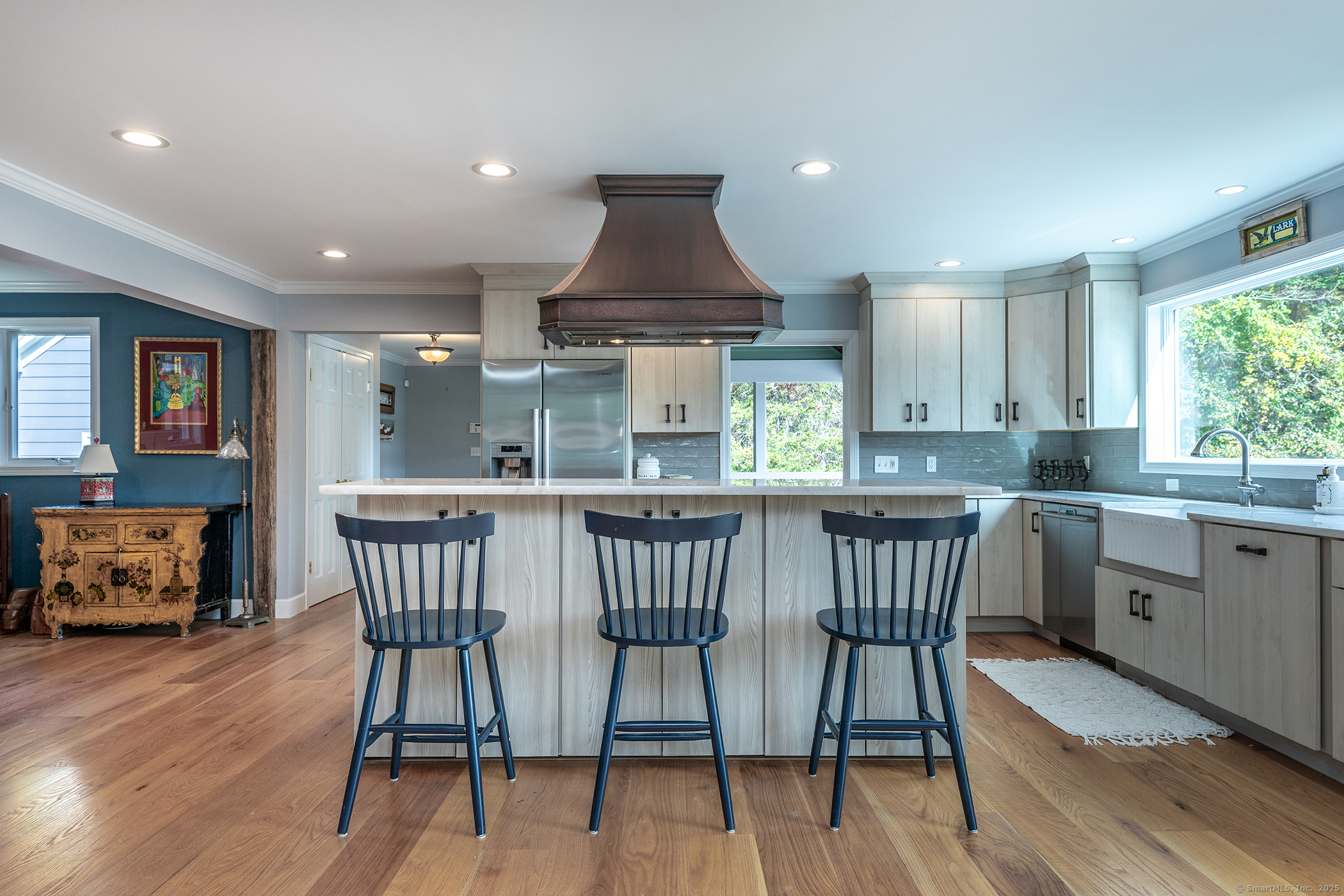 168 Cobble Road Kent, CT 06757 - Photo 7 of 40 a kitchen with stainless steel appliances granite countertop a dining table chairs and window