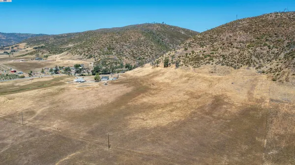 a view of a mountain view with mountains in the background