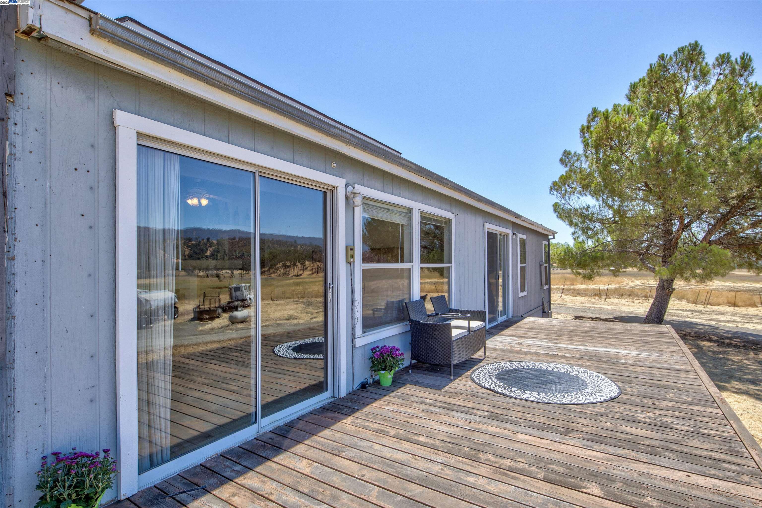 7878 Butts Canyon Road Pope Valley, CA 94567 - Photo 4 of 28 a front view of a house with outdoor seating