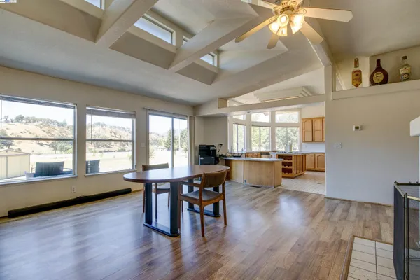a view of a livingroom with furniture window and wooden floor