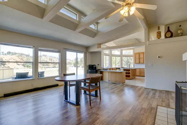 a view of a livingroom with furniture window and wooden floor