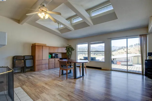 a view of a livingroom with furniture window and wooden floor