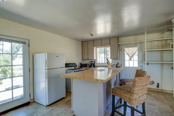 a dining room with furniture and a window