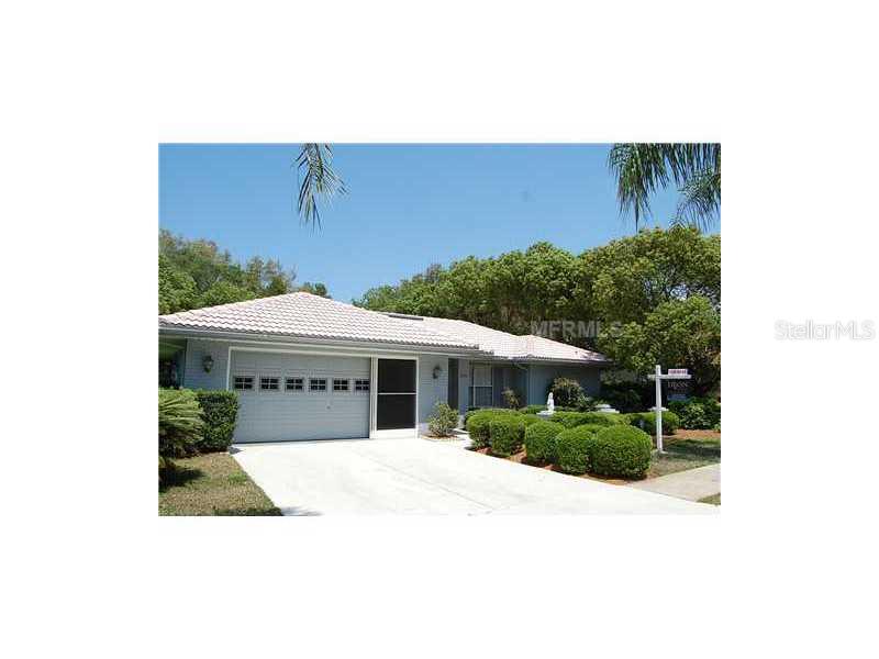 6126 Caliber Court New Port Richey, FL 34655 - Photo 1 of 1 a view of a house with a yard