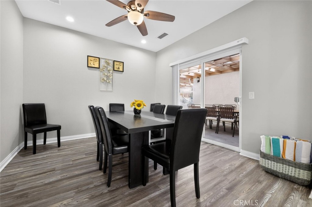 67972 Monterico Road Desert Hot Springs, CA 92240 - Photo 17 of 30 a view of a dining room with furniture wooden floor and chandelier