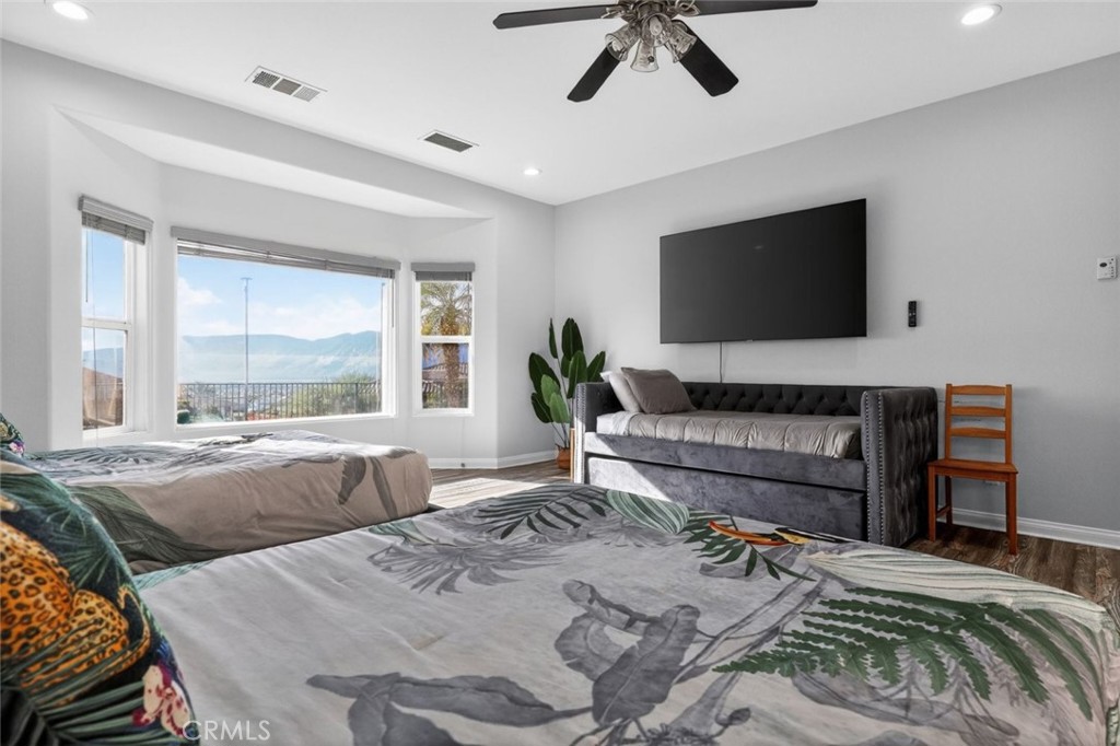 67972 Monterico Road Desert Hot Springs, CA 92240 - Photo 20 of 30 a bedroom with a bed and a flat screen tv