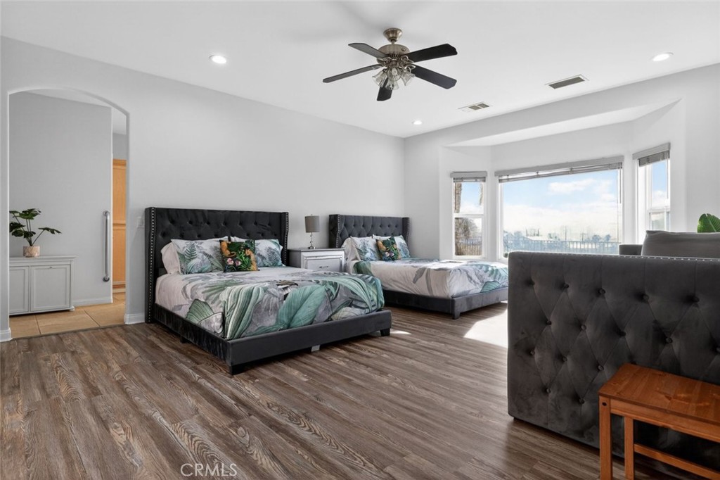 67972 Monterico Road Desert Hot Springs, CA 92240 - Photo 21 of 30 a bedroom with a large bed and a couch