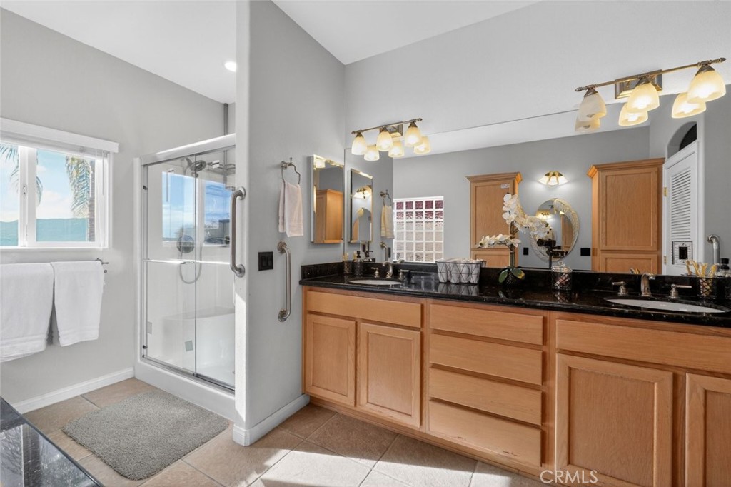 67972 Monterico Road Desert Hot Springs, CA 92240 - Photo 25 of 30 a bathroom with double vanity and a mirror