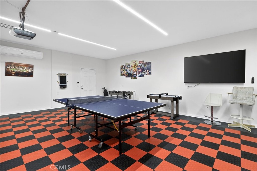 67972 Monterico Road Desert Hot Springs, CA 92240 - Photo 29 of 30 a living room with a dining table and a flat screen tv