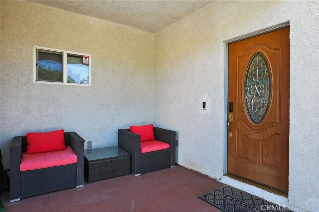 67972 Monterico Road Desert Hot Springs, CA 92240 - Photo 6 of 30 a bench sitting in a room next to a small bathroom