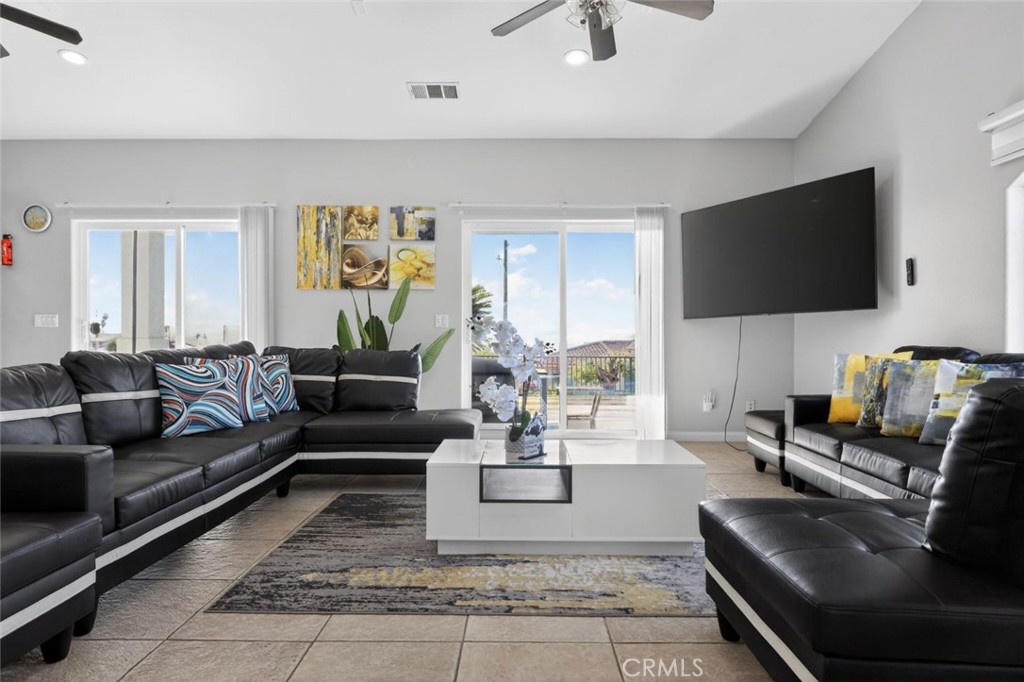 67972 Monterico Road Desert Hot Springs, CA 92240 - Photo 8 of 30 a living room with fireplace furniture and a flat screen tv