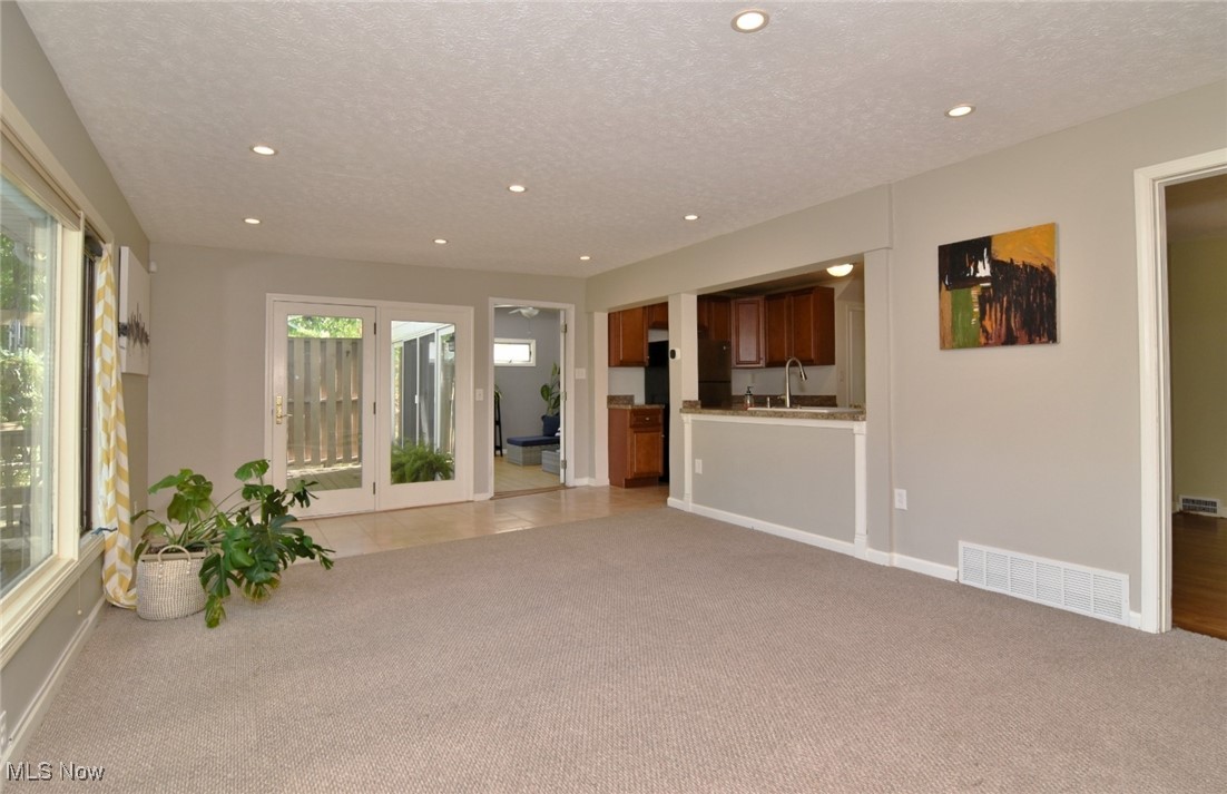 3679 Fenley Road Cleveland Heights, OH 44121 - Photo 19 of 45 Unfurnished living room with light colored carpet, a textured ceiling, and recessed lighting