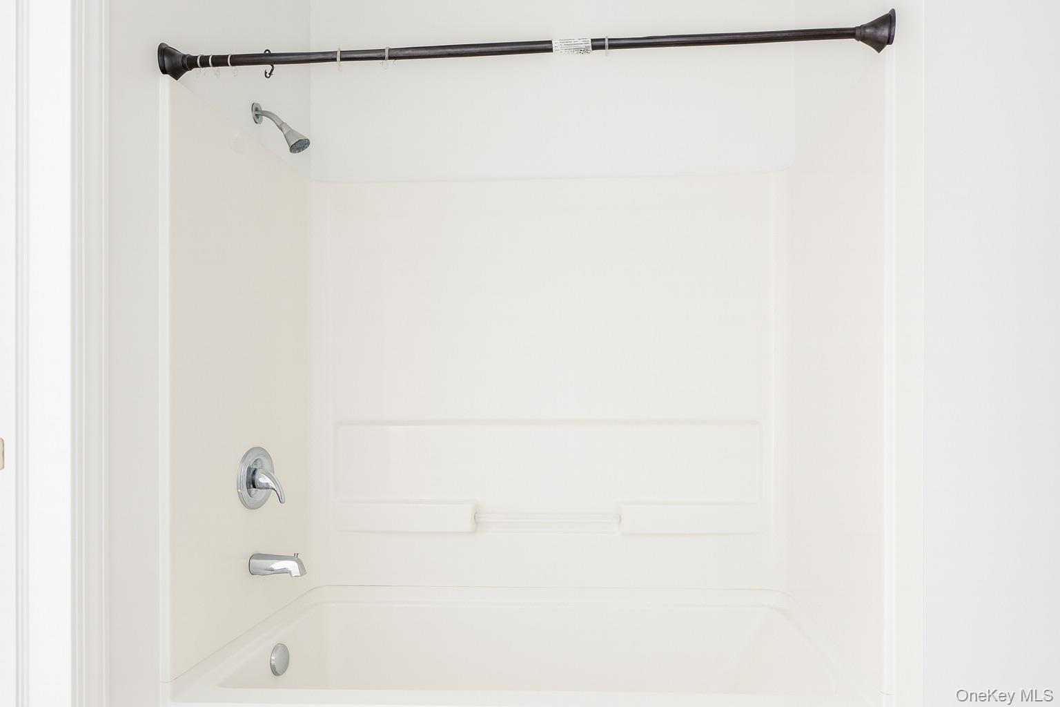 422 Broadway, Unit 5 Monticello, NY 12701 - Photo 4 of 9 a bathroom with a shower