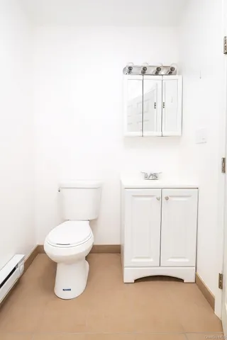 a bathroom with a toilet and a sink