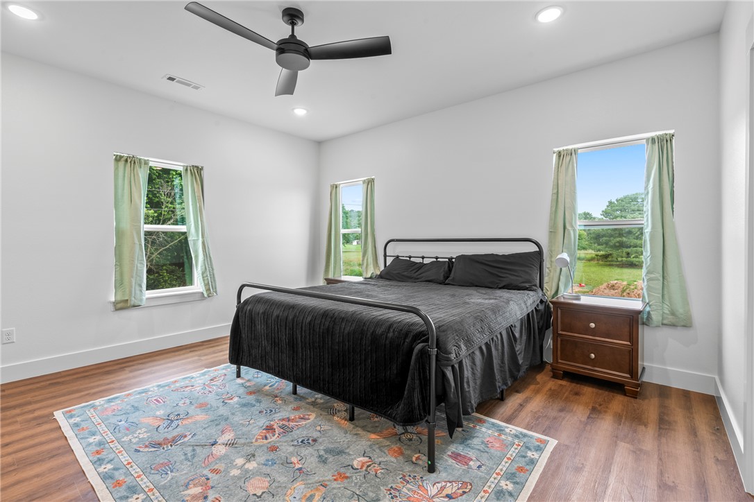 16556 East Hewitt Springs Road Springdale, AR 72764 - Photo 51 of 60 Spacious room featuring wood-finish flooring, white walls, recessed lighting, and a modern ceiling fan
