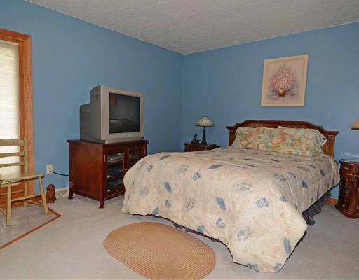 221 Monks Road Valencia, PA 16059 - Photo 6 of 18 Master Bedroom. Two double closets, neutral carpet, patio doors to deck.