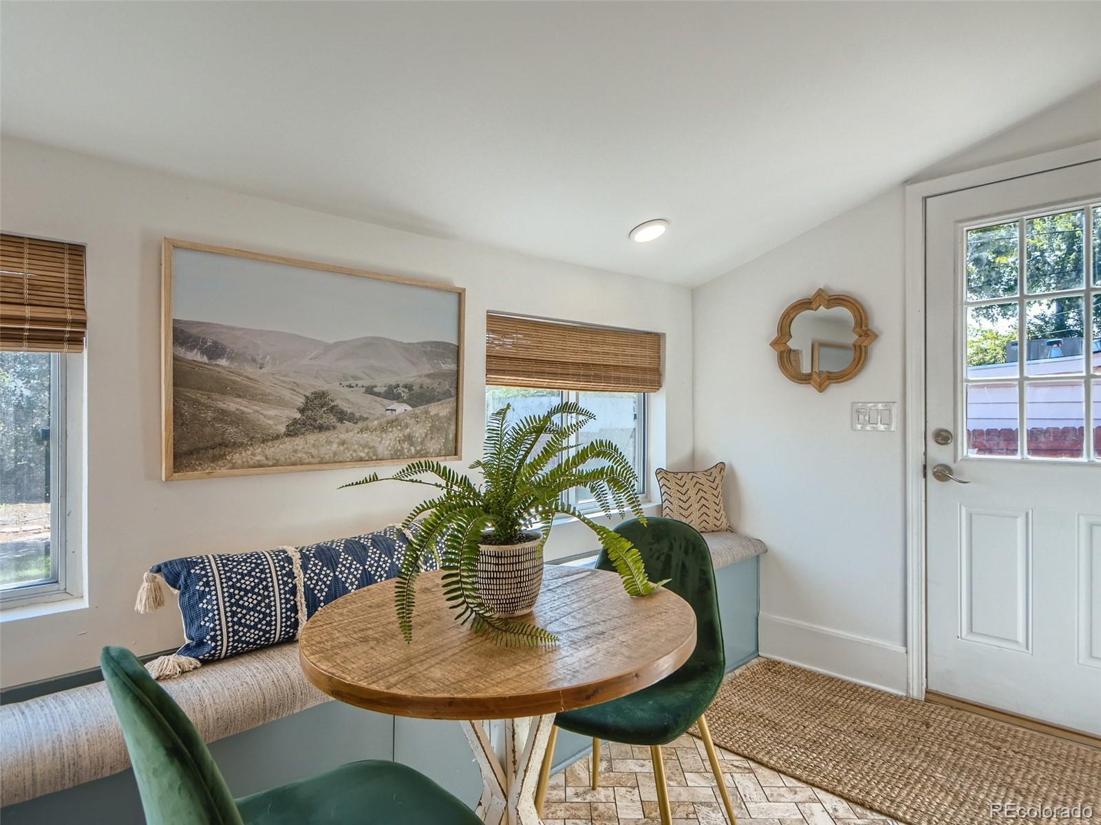2958 Hooker Street Denver, CO 80211 - Photo 15 of 40 a dining room with furniture and wooden floor