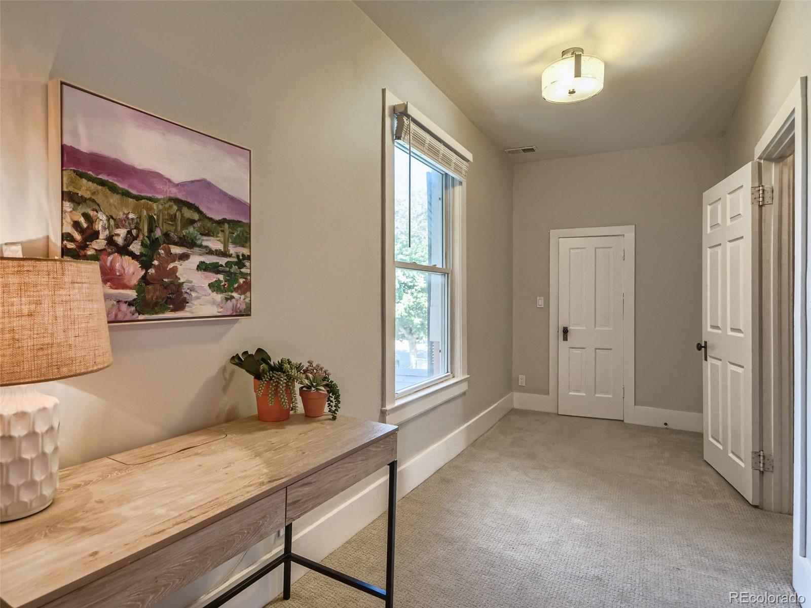 2958 Hooker Street Denver, CO 80211 - Photo 20 of 40 a workspace with furniture and window