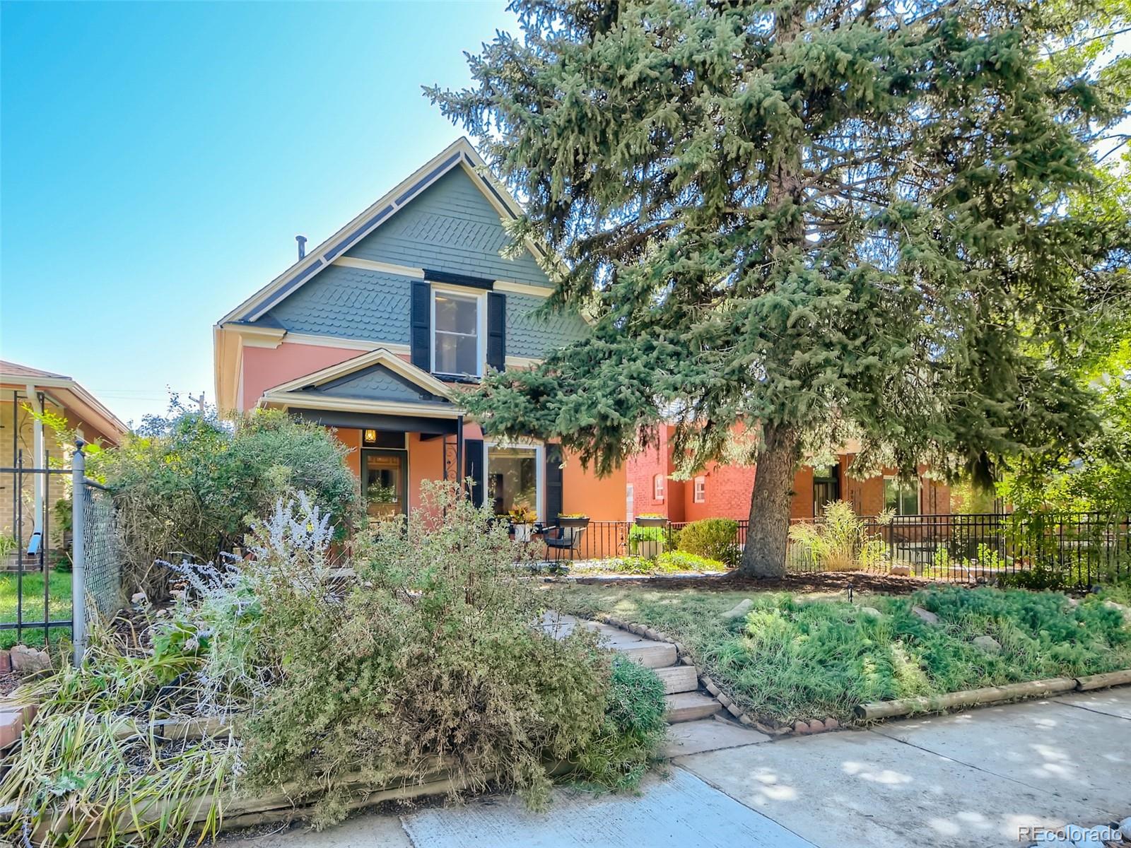 2958 Hooker Street Denver, CO 80211 - Photo 3 of 40 a front view of a house with a yard