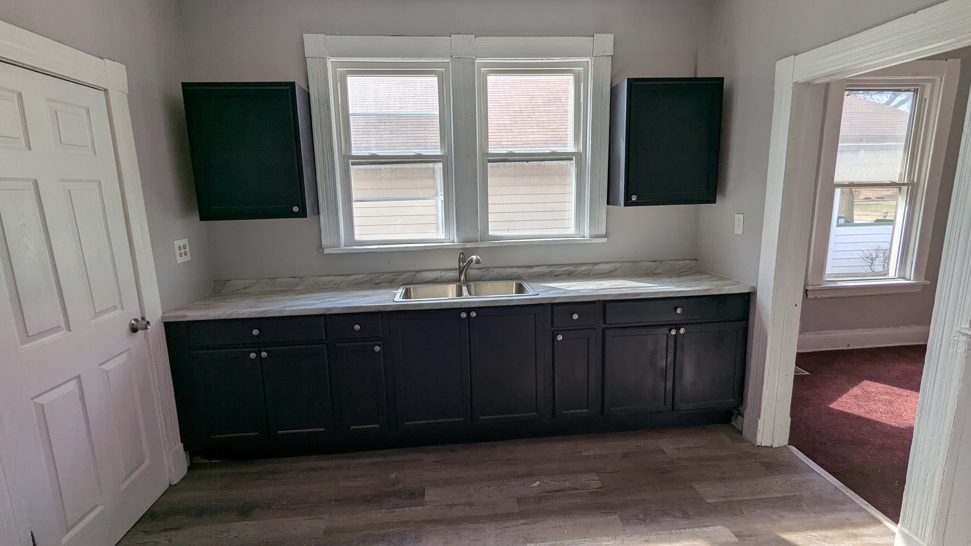 8817 South Elizabeth Street Chicago, IL 60620 - Photo 2 of 17 a bathroom with a double vanity sink and mirror