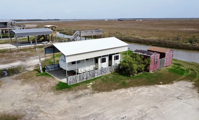 an aerial view of a house with a ocean view