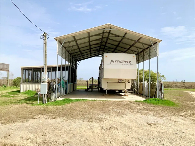 a view of a car park in front of house