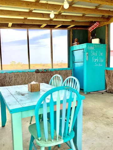 a view of a chairs and table in the patio