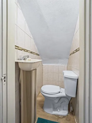 a bathroom with a toilet and a sink