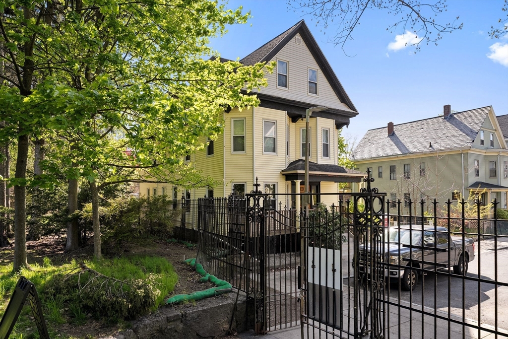 83 Tower Street Boston, MA 02130 - Photo 4 of 10 a front view of a house with a yard