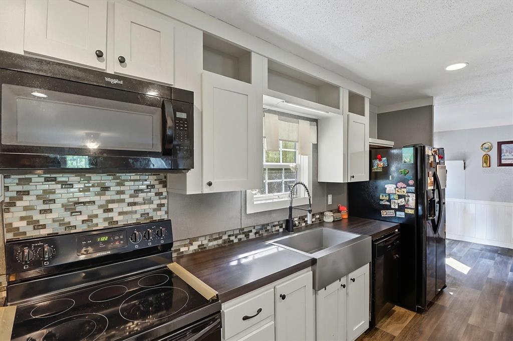 4801 North Mattox Point Crystal River, FL 34428 - Photo 16 of 46 a kitchen with a stove and a microwave