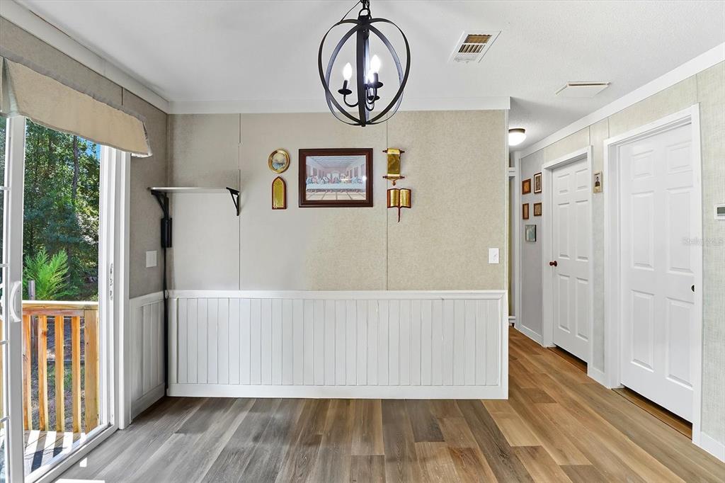 4801 North Mattox Point Crystal River, FL 34428 - Photo 20 of 46 a view of a hallway with wooden floor and a front door