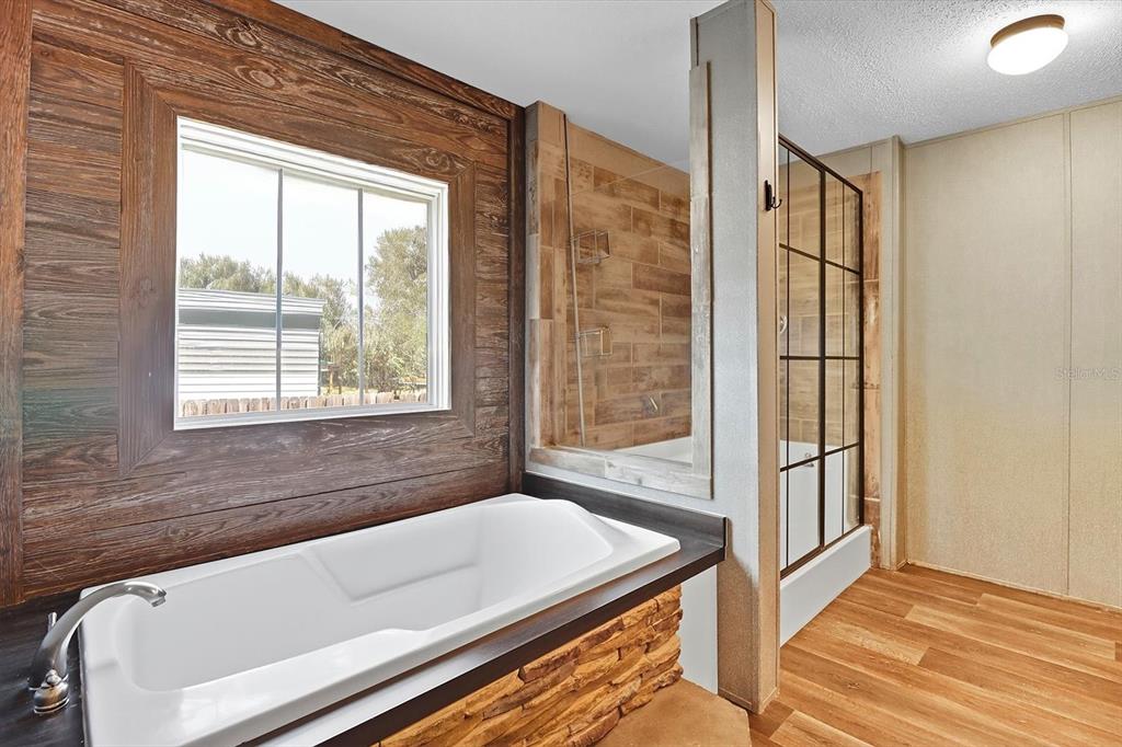 4801 North Mattox Point Crystal River, FL 34428 - Photo 26 of 46 a bathroom with a bathtub and next to a window