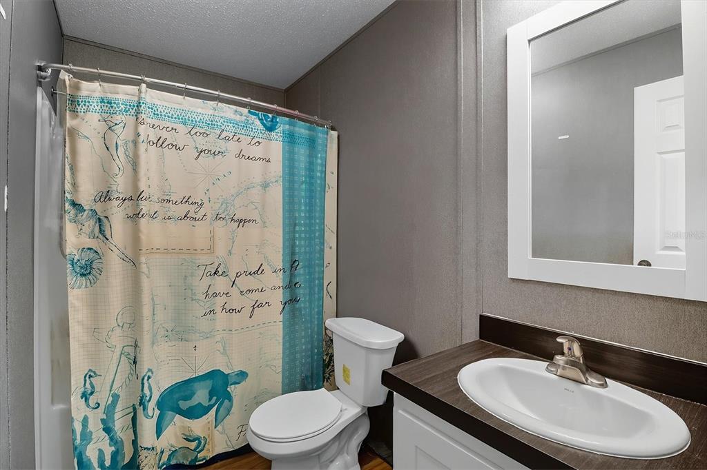 4801 North Mattox Point Crystal River, FL 34428 - Photo 30 of 46 a bathroom with a sink toilet and shower